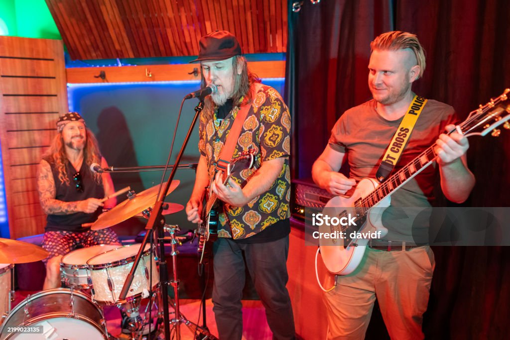 Middle Aged Men Playing in a Rock Music Band